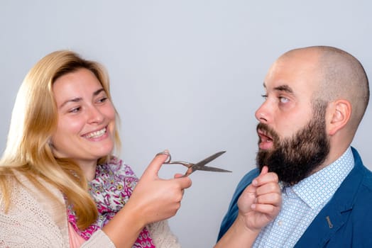 young man is not so happy with beard- cutting
