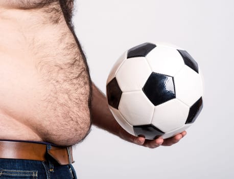 portly belly of a man with black and white football