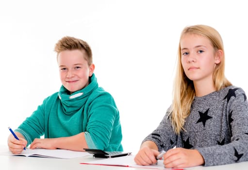girl and boy learning together in the classroom