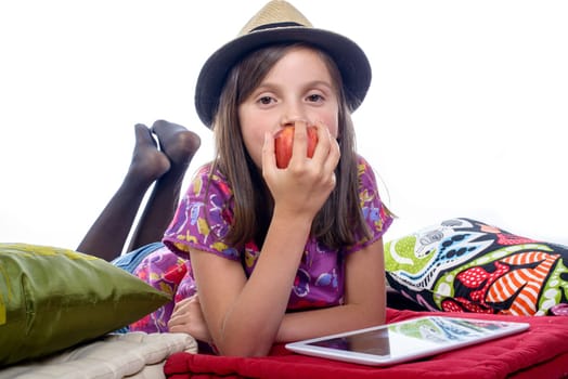 girl with a digital tablet and an apple in his hand