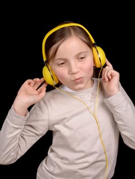 a girl with yellow headphones