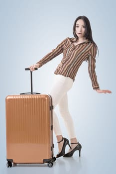 Modern Asian woman stand with a luggage.