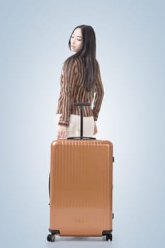 Modern Asian woman stand with a luggage.