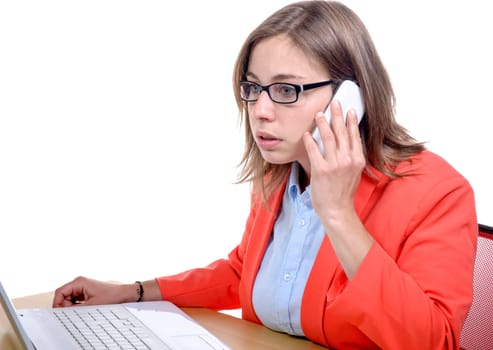 A pretty young secretary uses his mobile phone in his office on the white background