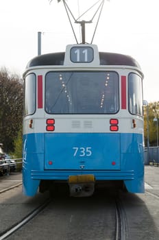one blue tramcar in sweden waiting for the people who will have transport