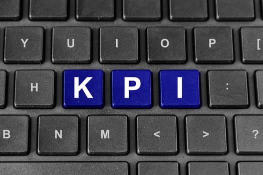 KPI or Key Performance Indicator blue word on keyboard
