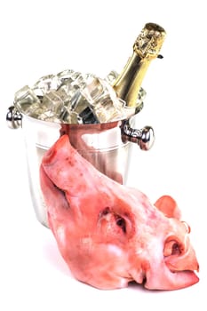 New Year's Eve party,pig's head with sparkling wine on white background