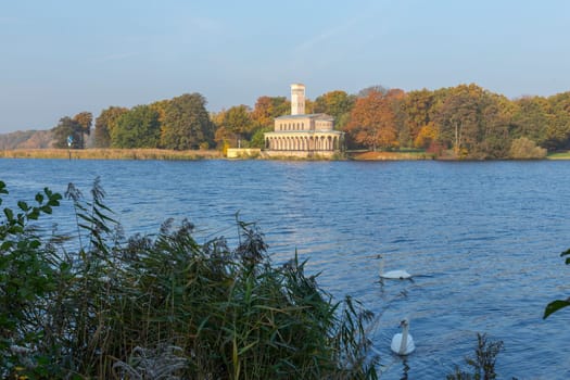 Sakrower church on the Jungfernsee with swans in the foreground