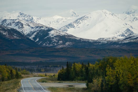 A bend in the road takes you along the base of beautiful Alaska Mountains