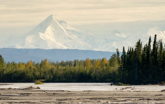 The Delta River curves around beneath the peaks of the Alaska Mountain Range