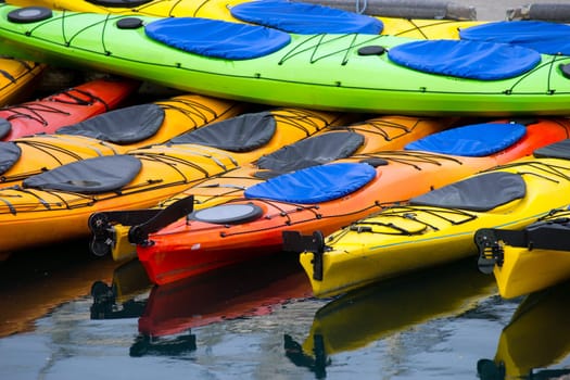 Kayaks wait for the next traveler to pay for a rental