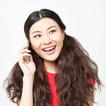 Young pretty girl busy on phone call