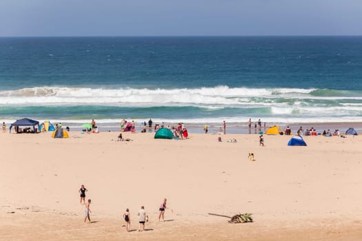 Holiday people umbrellas beach blue ocean landscape