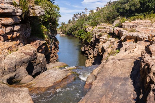 Rugged scenic beauty holiday destination of uvongo waterfall cliffs ravine lagoon beach ocean landscape