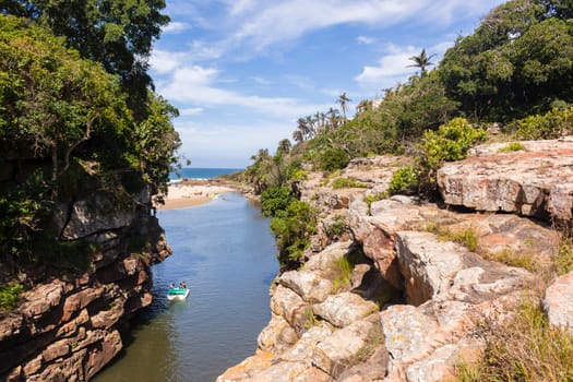 Rugged scenic beauty holiday destination of uvongo waterfall cliffs ravine lagoon beach ocean landscape