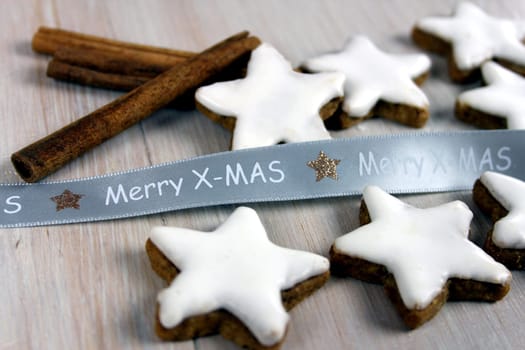 Cinnamon stars,cinnamon sticks and gift ribbon