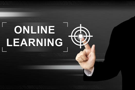 business hand clicking online learning button on a touch screen interface