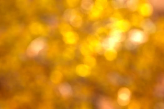 Abstract circular natural golden light bokeh background