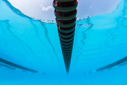 Underwater upward of swimming pool race gala lane markers.