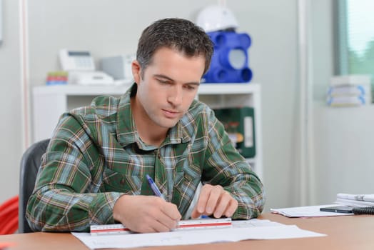Architect drawing up plans