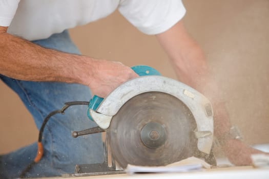 Carpenter using a circular saw