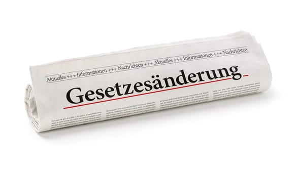 Newspaper roll with the headline Change of Law