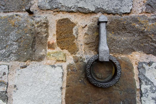 Close-up of an antique ring for tying horses