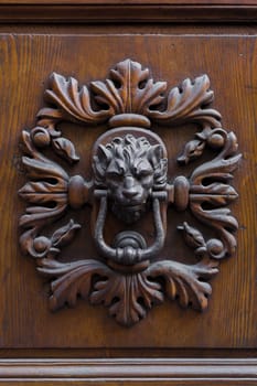 Close-up view of an ancient Tuscan iron knocker