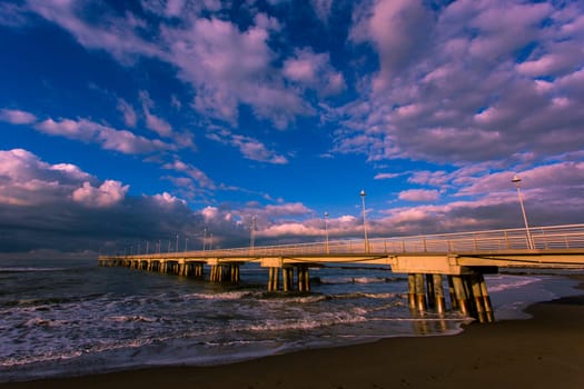 Bottom view of the sea pier in Marina di Massa