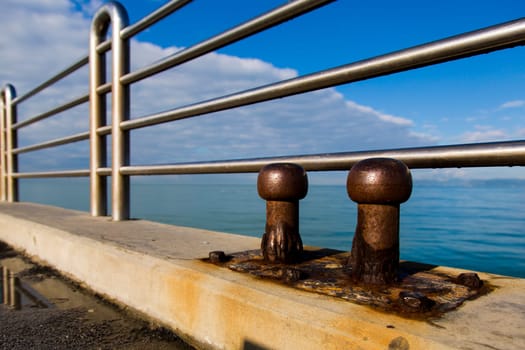 View of two old cleats of a pier marine eroded by salt