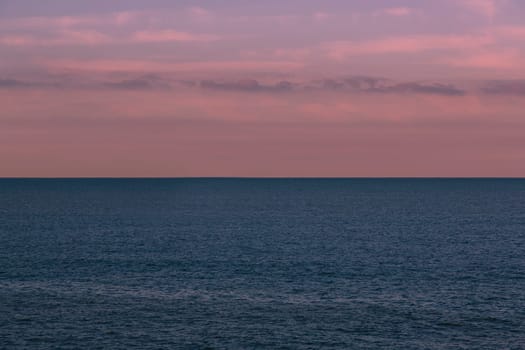 Seascape with a merchant ship in the background