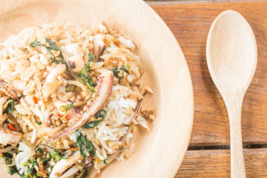 Rice topped with stir-fried squid basil (Thai food), stock photo