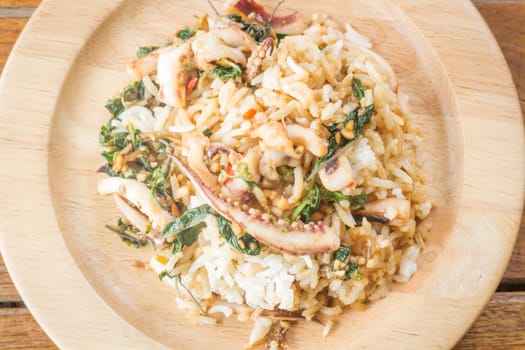 Rice topped with stir-fried squid basil (Thai food), stock photo