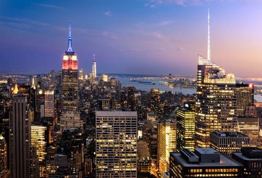 New York City skyline with urban skyscrapers at sunset, USA.