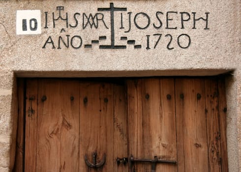 Jewish neighborhood door with inscriptions over the door, Caceres, Spain