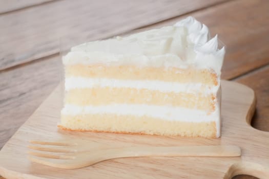 Coconut sponge cake with whipped cream, stock photo