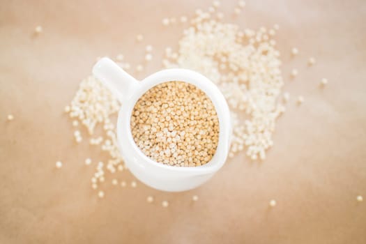 Raw organic white quinoa seeds, stock photo