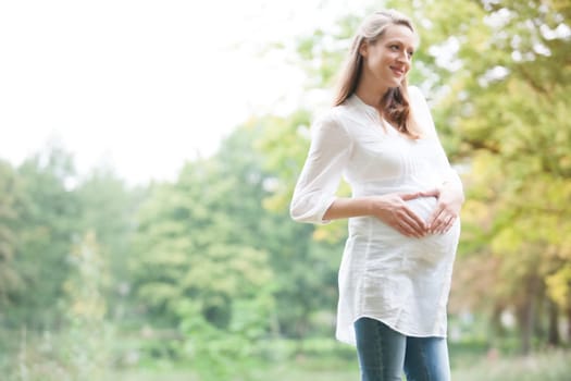 Young new mother is having fun outside