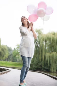 Young new mother is having fun outside