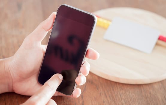 Smart phone in a woman's hand, stock photo