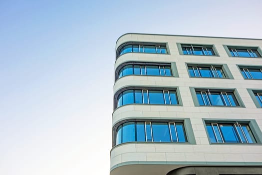 Detail of an modern office building, light blue sky