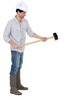 craftsman holding a hammer