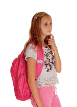 A blond pretty girl standing with her pink backpack for school, looking up.and thinking, isolated for white background..