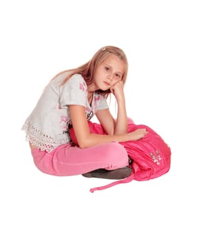 A beautiful young girl sitting sad on the floor holding her pink pack back,.isolated for white background..
