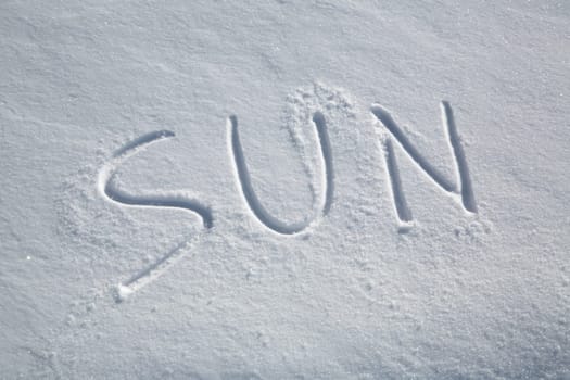 The word SUN written in the snow