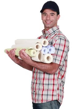 Man carrying rolls of wall-paper