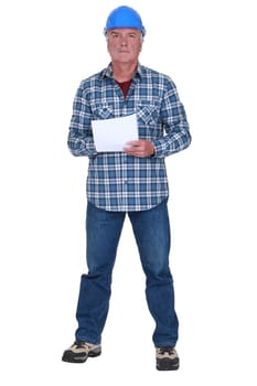 Craftsman holding paper