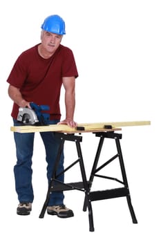 craftsman cutting a board