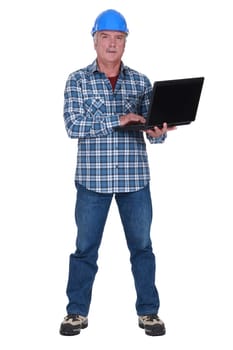 Tradesman holding a laptop