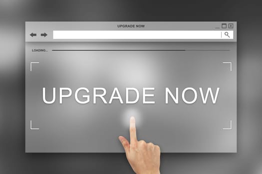 hand press on upgrade now button on webpage